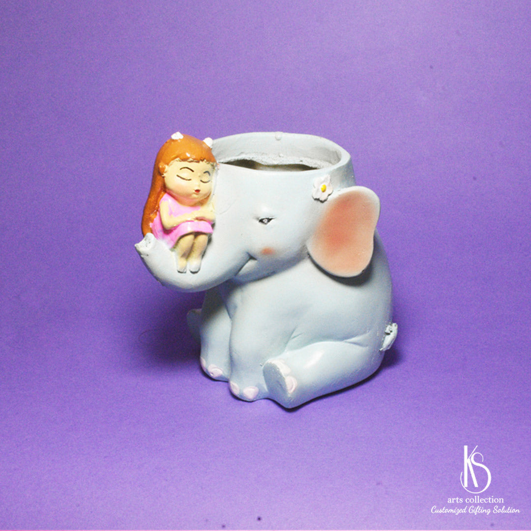 Discover the charm of our KS Girl on Elephant Resin Pot! This adorable planter is a perfect personalised gift. Grab it from our online gift shop now.