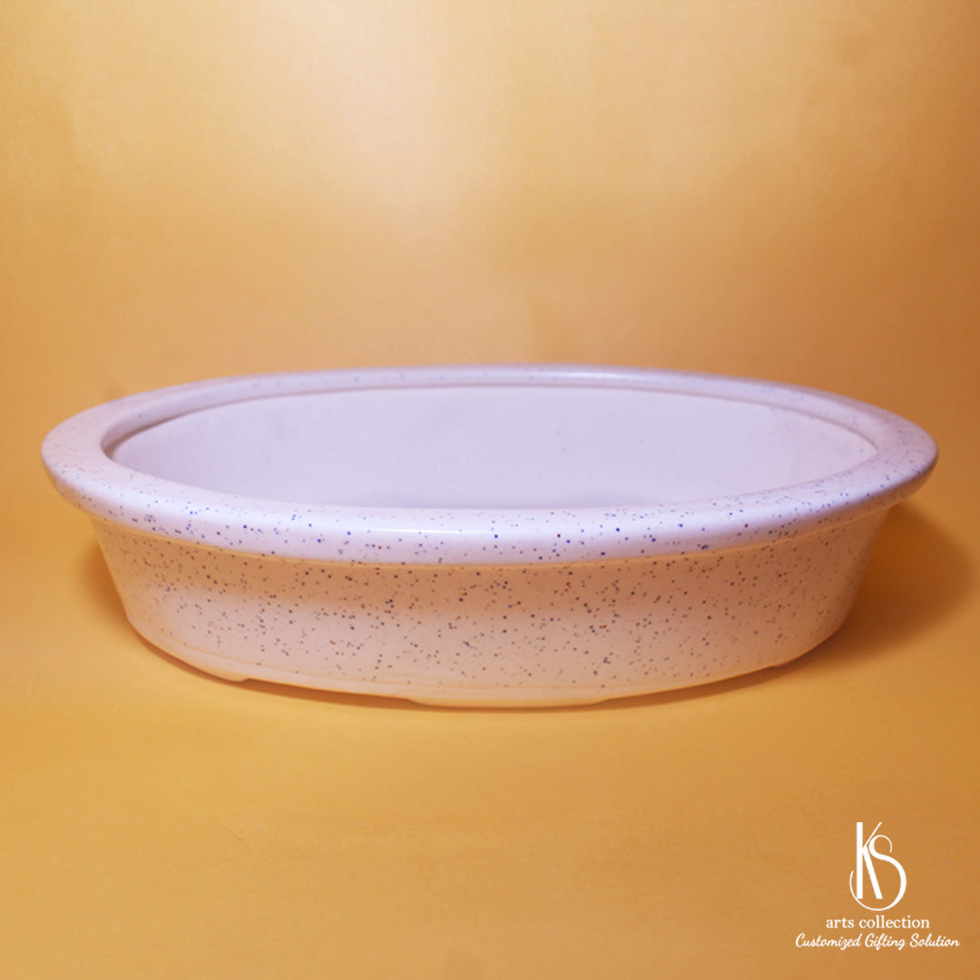 Transform your space with our KS Oval Shape Ceramic Bonsai Tray! Available at our online gift shop, it's a great planter for your little greens.