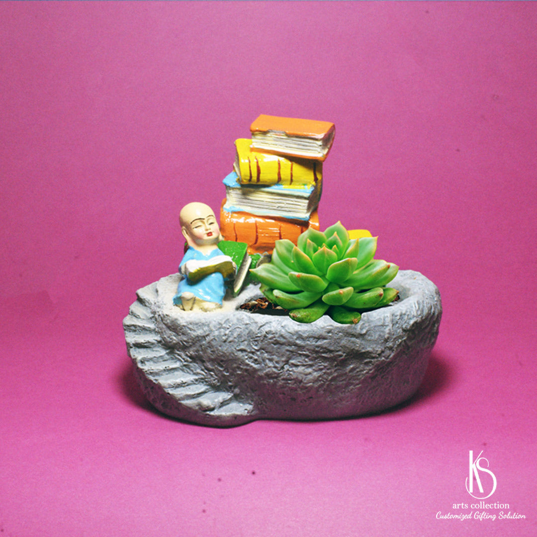 Add some zen to your home with our KS Reading Monk Resin Pot! This adorable planter from our online gift shop makes a thoughtful personalised gift.