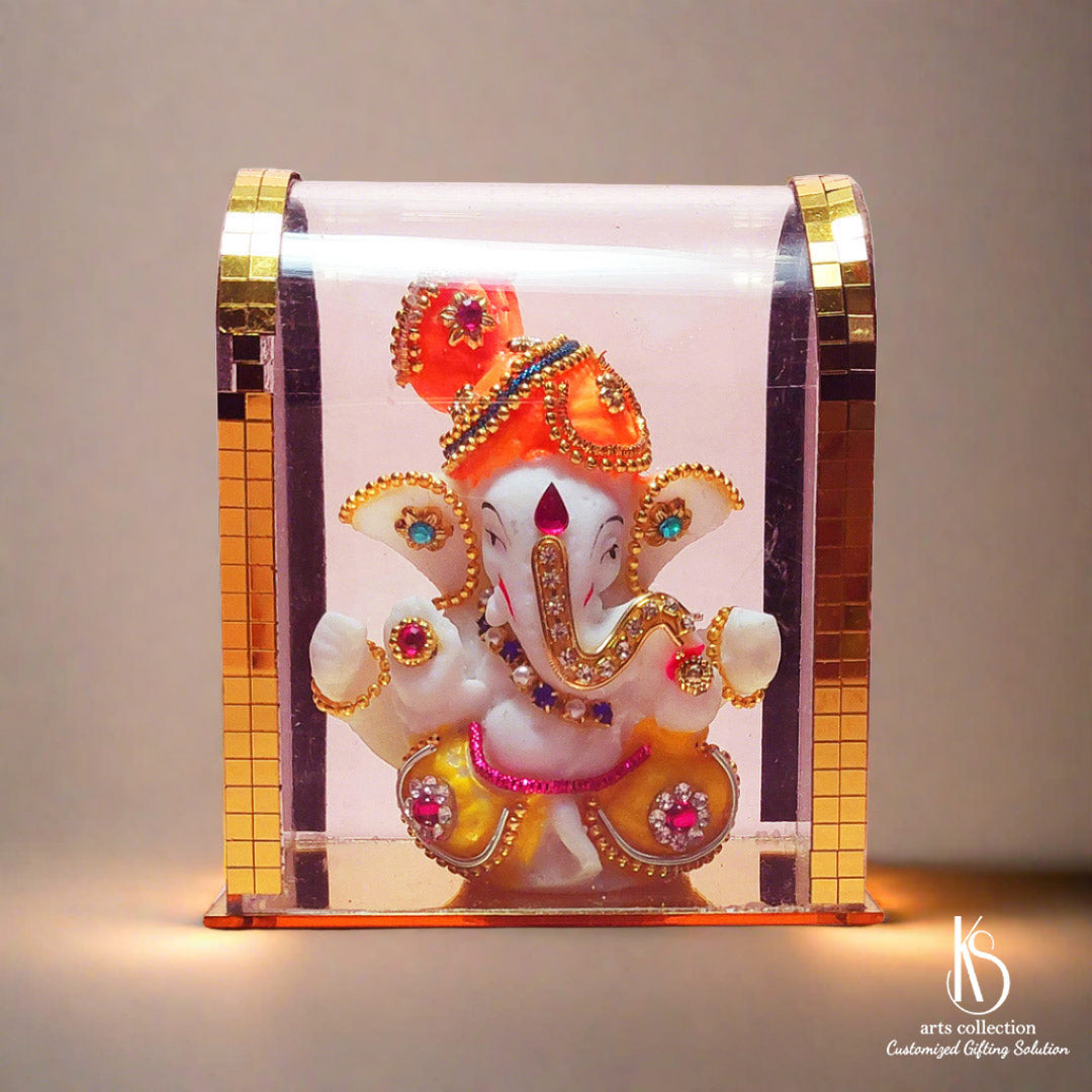 Add charm to your space with the KS Arts Collection's KS Little Ganesh idol in Glass, a unique and personalized gift that embodies grace and spirituality